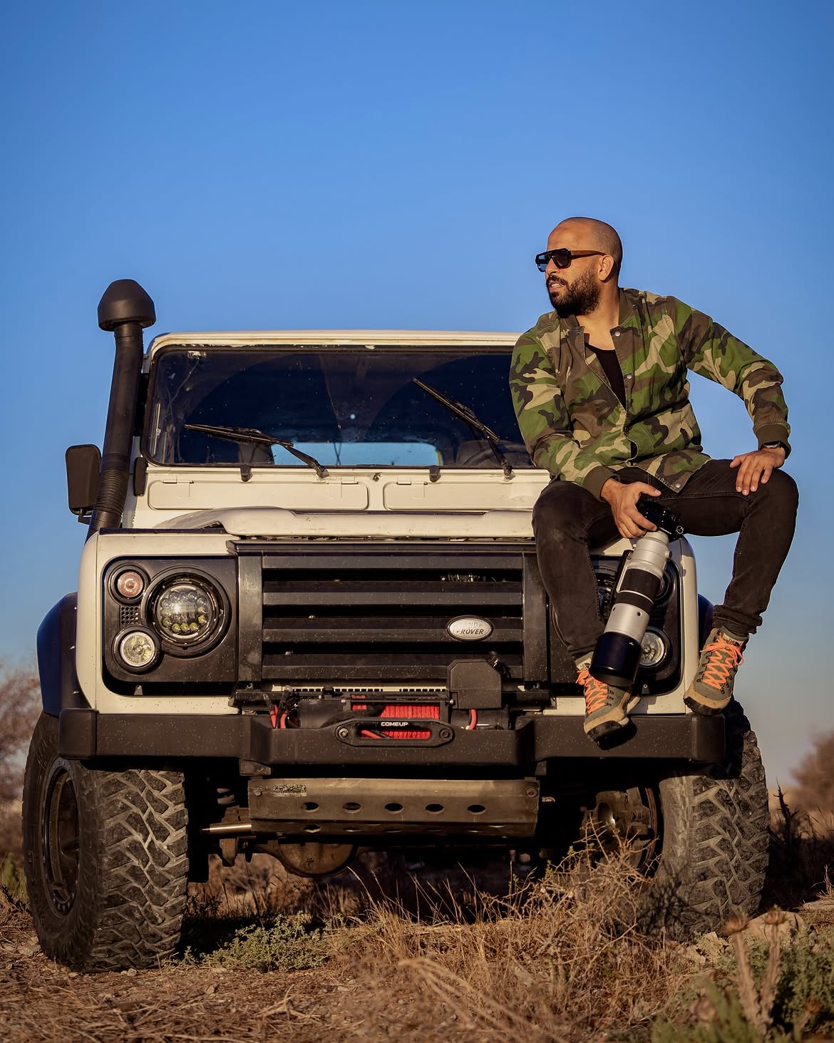 Photographer beside a vehicle in the Tunisian landscape