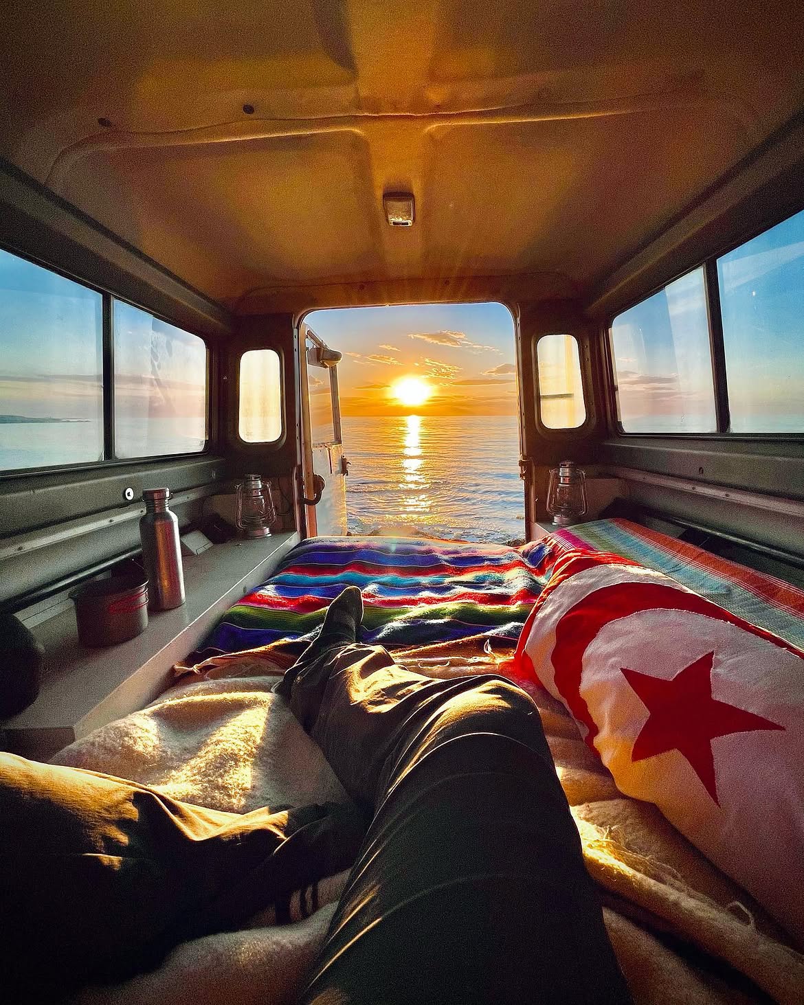 Sunset seen through the rear of a vehicle
