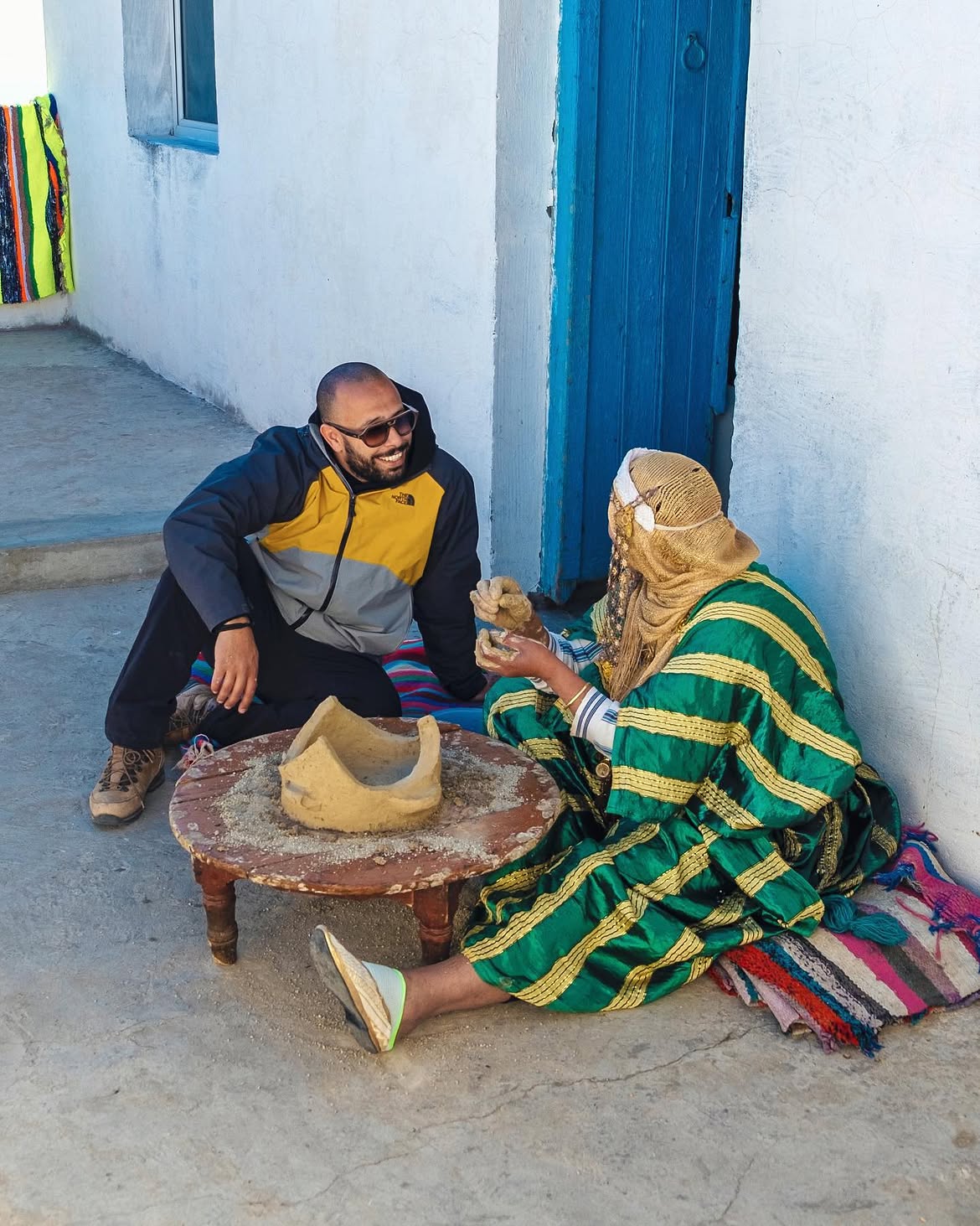 Man in conversation with a woman on a street