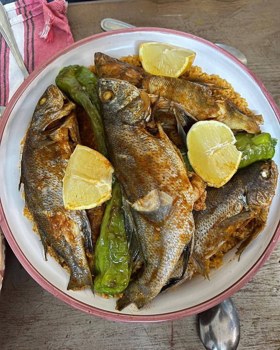 Cooked fish with lemon on a plate
